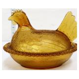 Vintage amber hen on nest