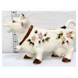White flgural cow creamer with pink flowers