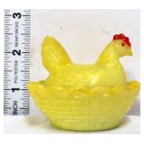 Vintage yellow mini hen on nest