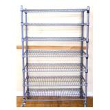 Grey metal industrail roll around shelf