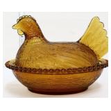 Vintage amber hen on nest
