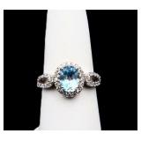 Sterling oval cut blue topaz ring, lab created