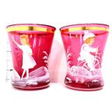 2 cranberry Mary Gregory style shot glasses