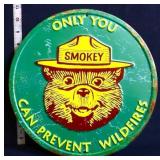 Green round metal Only You Smokey Bear sign