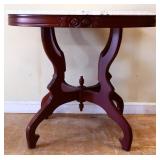 Kimball oval marble top parlor table