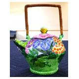 Colorful floral teapot with woven handle