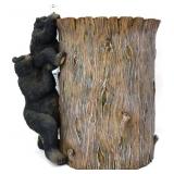 Resin bears on tree trash can