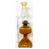 Vintage oil lamp with amber tone base