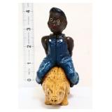 Cast iron americana boy on pig