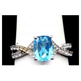 Sterling emerald cut blue topaz ring, lab created