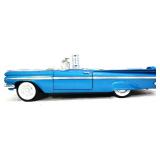 Die cast blue Chevy Impala convertible