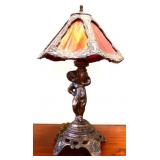 Metal figural lamp w/ slag glass shade