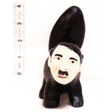 Cast iron skunk w/ man face