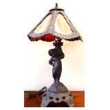 Metal figural lamp w/ slag glass shade