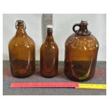 3 VINTAGE AMBER COLORED BOTTLES & JUGS