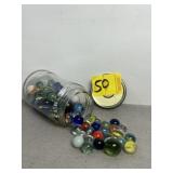 SMALL JAR OF VINTAGE MARBLES