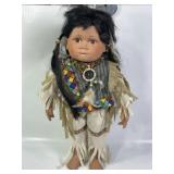 PORCELAIN NATIVE AMERICAN DOLL W/ BEAD WORK, 20"T