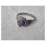 SILVER TONE ADJUSTABLE RING W/ BLUE STONE