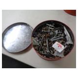 TIN FULL OF BOLTS