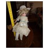 GERMANY ROA PORCELAIN DOLL IN ROCKER