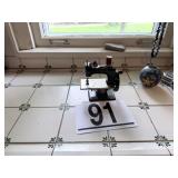 Child;s toy sewing machine