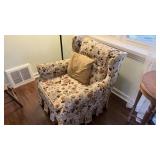 Upholstered chair and floor lamp