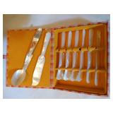 (7) Mother of Pearl butterknives (1) spoon