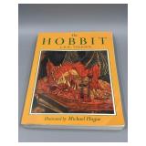 The Hobbit Paperback by J.R.R. Tolkien.