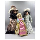 2 Porcelain Dolls & Lighted Tree Topper