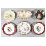 A Collection of Six Decorative Porcelain Plates...
