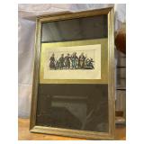 Framed hand-colored print depicting figures in his