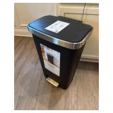 Trash Can and Contents of Kitchen Cabinet