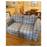 Blue couch and loveseat with throw pillows
