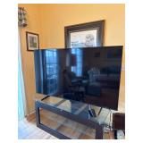 65 inch Samsung Flatscreen TV and glass entertainm