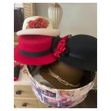 Assorted hats with hat box