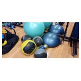 GROUP OF MEDICINE BALLS AND BALANCE BUTTON