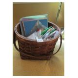 Basket full of knitting needles/craft supplies