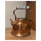 Copper tea pot with porcelain handle