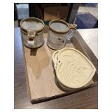 Pottery mugs and cookie molds