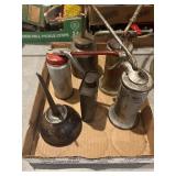 Six assorted metal oil cans, vintage