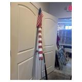 Large American flag and two small flags