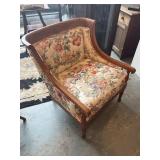 Vintage wooden arm chair with curved barrel back,