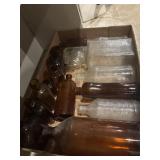 17 vintage glass bottles, several amber