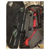 Red Genesis compound bow in Plano hard storage