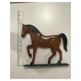Vintage cast-iron horse with mounting screws