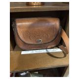 Vintage brown hand tooled leather saddle bag,