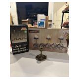 7 piece NIB solid brass candlesticks, one older,