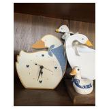 Duck decor includes clock, wooden napkin holder,