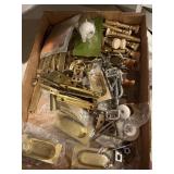 box of vintage and modern brass household