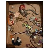 Box of miscellaneous jewelry, earrings, pins,